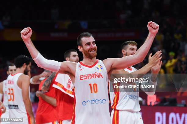 Spain's Victor Claver celebrates their victory at the end of the Basketball World Cup semi-final game between Australia and Spain in Beijing on...