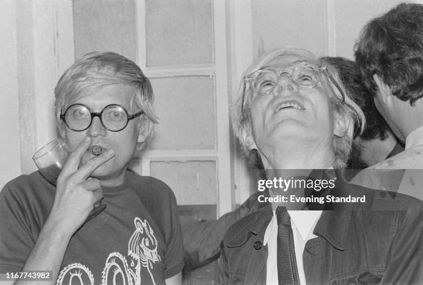 English painter, draftsman, printmaker, stage designer, and photographer David Hockney and American artist, director and producer Andy Warhol , UK,...