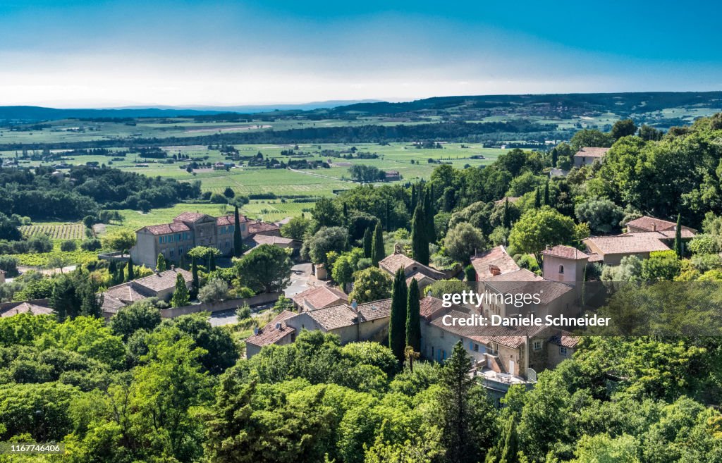 France, Vaucluse, plunging view over the perched village of Seguret (Plus Beau Village de France - Most Beautiful Village of France) (Camino de Santiago) and the Rhone valley