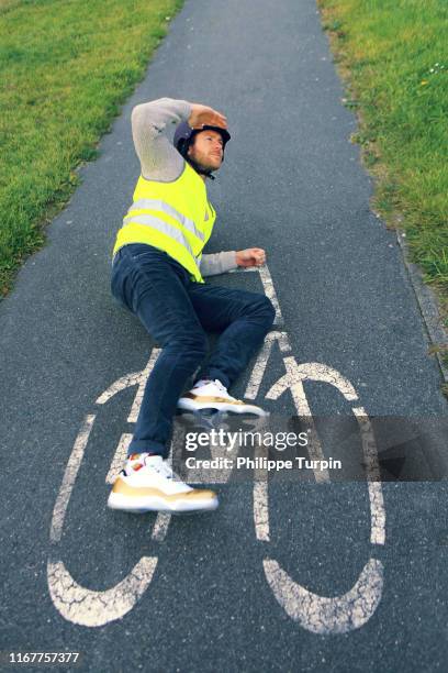 young man with bike - velo humour stock-fotos und bilder