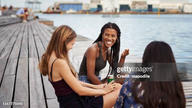 the easiest friendships are the best - urban areas　water front stock pictures, royalty-free photos & images