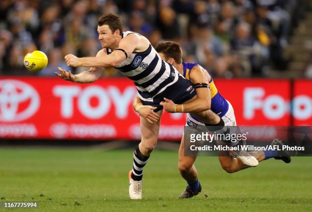 Patrick Dangerfield of the Cats is tackled by Elliot Yeo of the Eagles during the 2019 AFL First Semi Final match between the Geelong Cats and the...