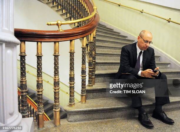 Federal Trade Commission Chairman Jon Leibowitz works on his Blackberry after meeting with Vice Presient Joe Biden on July 29, 2010 at the Eisenhower...
