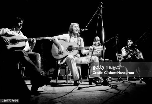 Wings perform on stage at Ahoy, Rotterdam, Netherlands, 25th March 1976. L-R Jimmy McCulloch, Denny Laine, Linda McCartney, Paul McCartney.