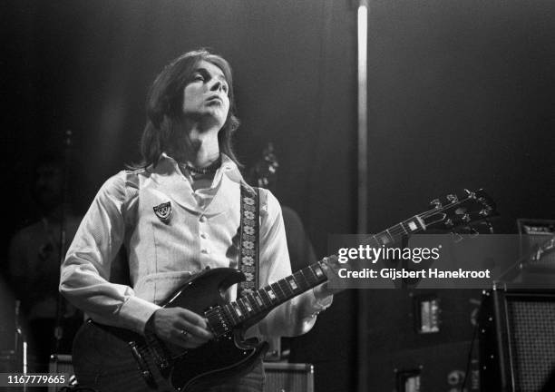 Guitarist Jimmy McCulloch of Wings performs on stage at Ahoy, Rotterdam, Netherlands, 25th March 1976. He is playing a Gibson SG guitar.