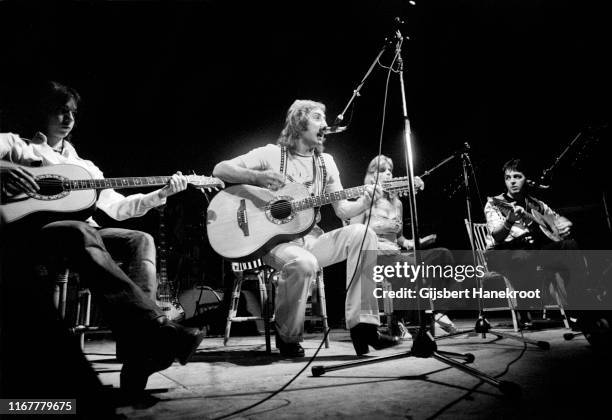 Wings perform on stage at Ahoy, Rotterdam, Netherlands, 25th March 1976. L-R Jimmy McCulloch, Denny Laine, Linda McCartney, Paul McCartney.