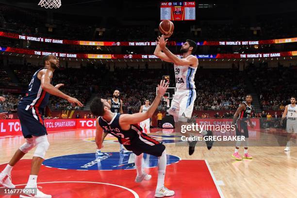 Argentina's Patricio Garino takes a shot during the Basketball World Cup semi-final game between Argentina and France in Beijing on September 13,...