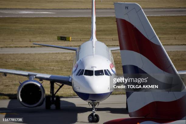 British Airways aeroplane takes off from the runway at Heathrow Airport's Terminal 5 in west London, on September 13, 2019. - British Airways has...