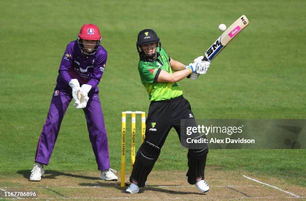 Heather Knight of Western Storm bats watched on by Amy Jones of Loughborough Lightning during the Kia Super League match between Western Storm and...