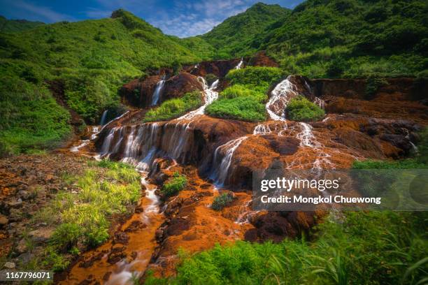 golden waterfall is one of the most beautiful waterfall in taiwan. it is located at jinguashi township near taipei in taiwan - volume fluid capacity stock pictures, royalty-free photos & images