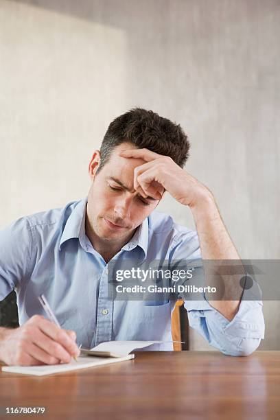 Man Write Check Man Writing A Check Photos and Premium High Res Pictures - Getty Images