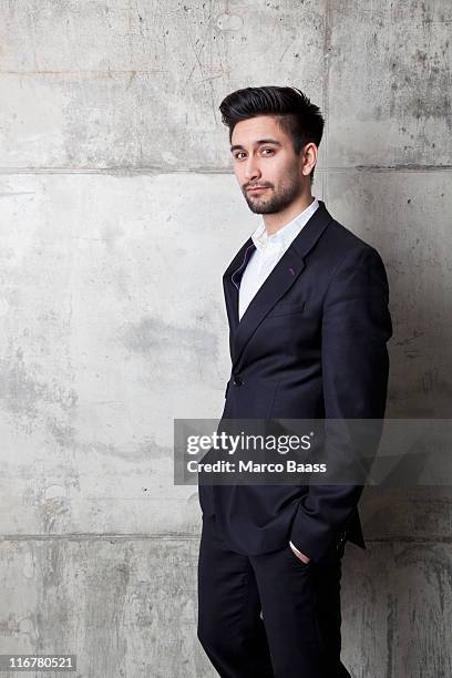 a young hip businessman with his hands in his pockets - no tie stock pictures, royalty-free photos & images