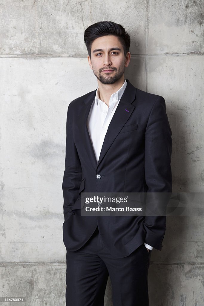 A young hip businessman with his hands in his pockets