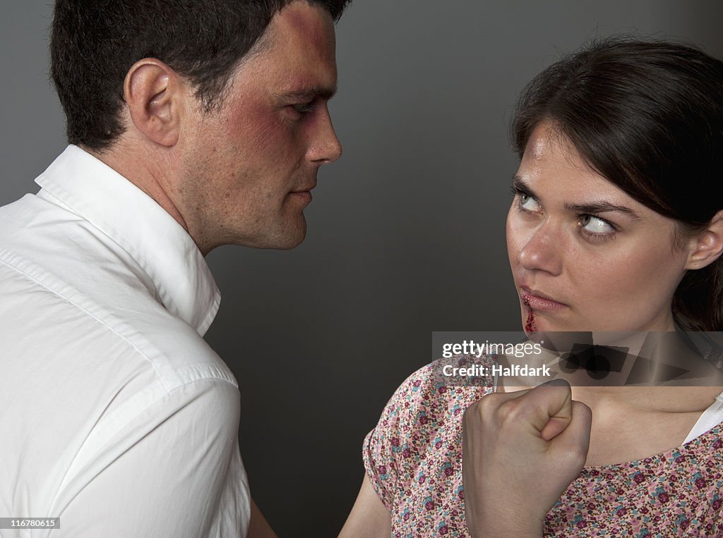 A woman and man fighting