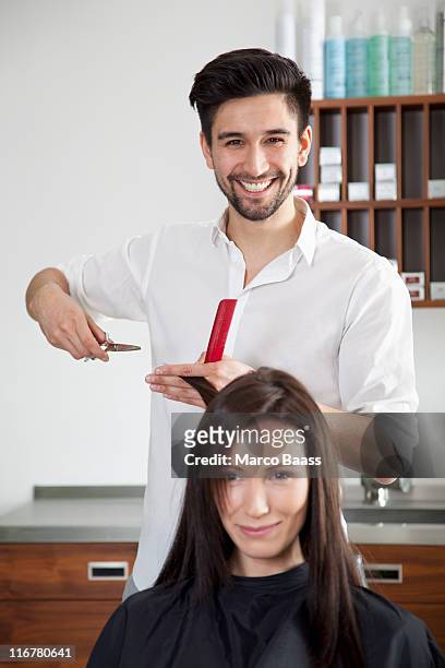 A Woman Having Her Hair Cut By A Male Hairdresser High-Res Stock Photo -  Getty Images