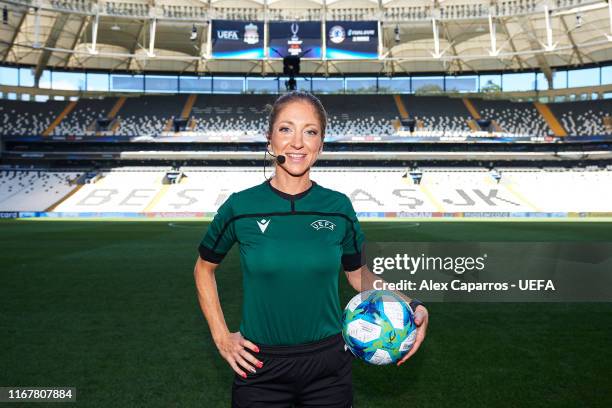 Assistant referee Manuela Nicolosi of France poses with the official match ball before a training session ahead of UEFA Super Cup Final at Besiktas...