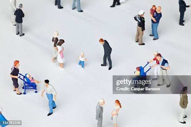 a group of miniature figurines - miniture stock pictures, royalty-free photos & images