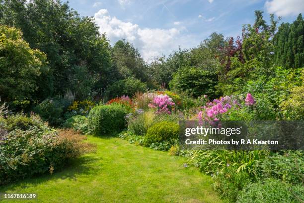 english country garden in august - border flower garden stock pictures, royalty-free photos & images