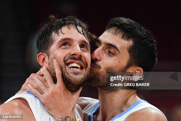 Argentina's Nicolas Laprovittola and Facundo Campazzo celebrate their victory at the end of the Basketball World Cup semi-final game between...