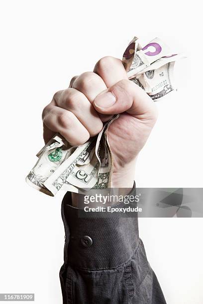 a man gripping a wad of us paper currency, close-up of hand - nota de cinco dólares americanos - fotografias e filmes do acervo