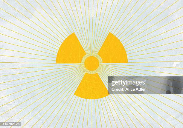 the sun and a radioactive symbol - radioactive warning symbol stock illustrations