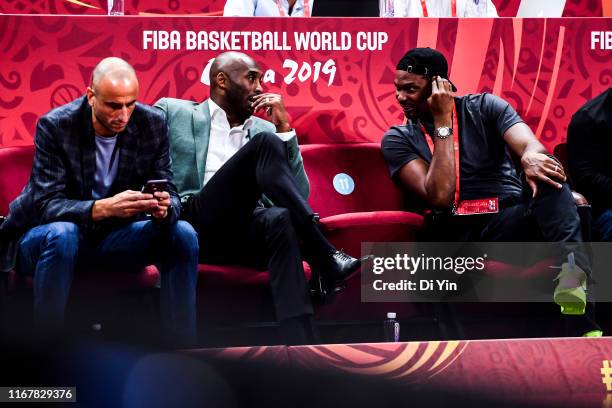 Manu Ginobili, Kobe Bryant and Chris Bosh talks to each other during the semi final march between Argentina and France of 2019 FIBA World Cup at the...