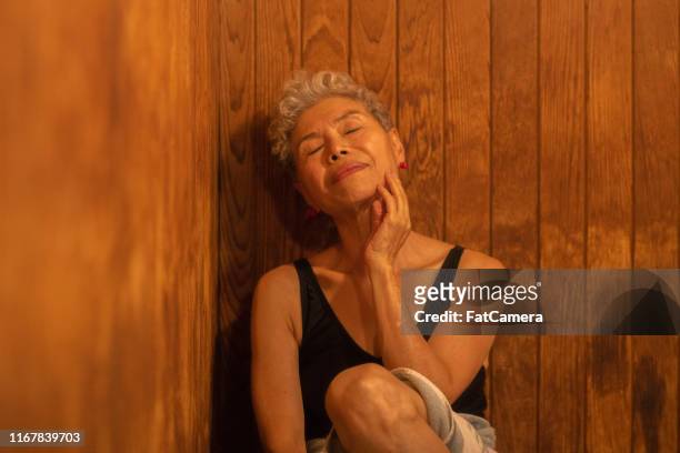 relaxing in a sauna - sauna stock pictures, royalty-free photos & images