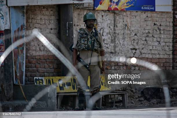 Paramilitary trooper stands guard during shutdown in Srinagar, Kashmir. Kashmir valley remained shut for the 40th consecutive day following the...
