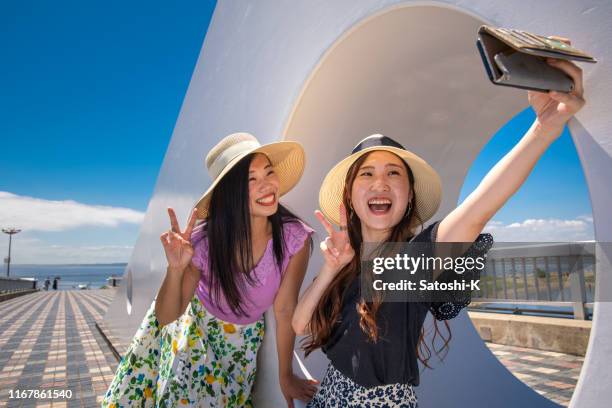 happy young female friends taking selfie picture in summer - self portrait photography stock pictures, royalty-free photos & images