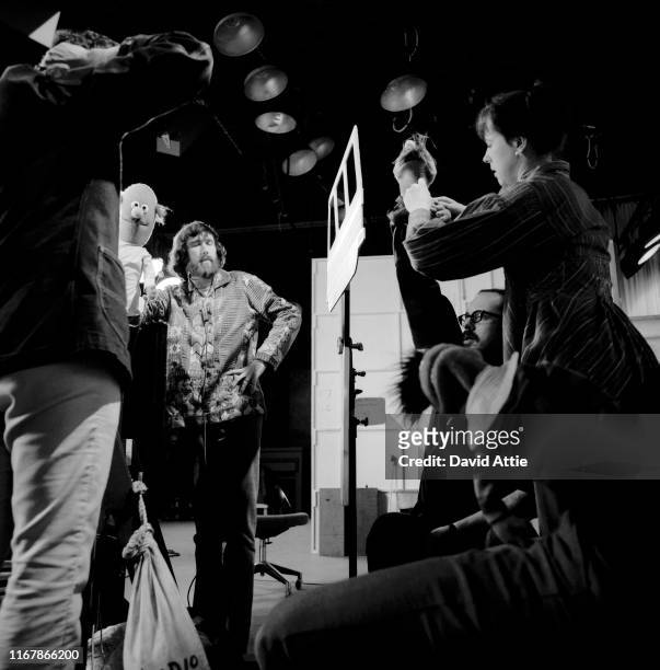 Producer Jon Stone , puppeteer Jim Henson holding an 'Anything Muppet' dentist, puppeteer Frank Oz holding an 'Anything Muppet' postman, and...