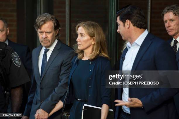 Actress Felicity Huffman, escorted by her husband William H. Macy and her brother Moore Huffman Jr. , exits the John Joseph Moakley United States...