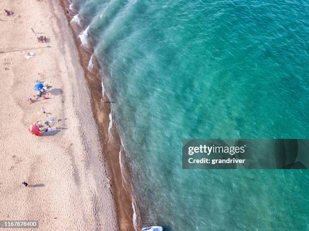 drone view of the beautiful blue water and sandy beaches of lake huron - lake huron stock pictures, royalty-free photos & images