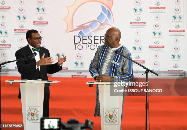 President Roch March Christian Kabore of Burkina Faso listens to African Development president Akinwumi Adesina at the end of a G5 sahel energy...