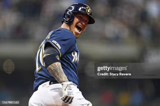 Yasmani Grandal of the Milwaukee Brewers celebrates following a three run home run against the Minnesota Twins during the seventh inning at Miller...