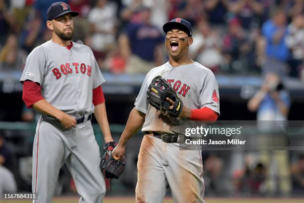 Relief pitcher Matt Barnes watches as Rafael Devers of the Boston Red Sox reacts after Oscar Mercado of the Cleveland Indians is called safe at first...