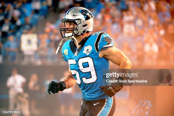 Carolina Panthers middle linebacker Luke Kuechly makes his way onto the field during player intros prior tothe game between the Tampa Bay Buccaneers...