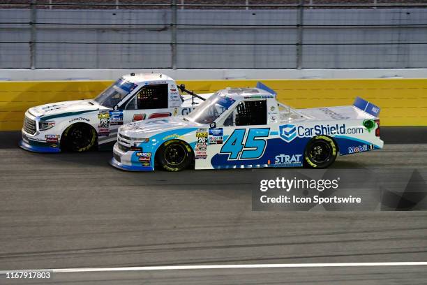 Ross Chastain Niece Motorsports Chevrolet Silverado and Austin Hill Hattori Racing Enterprises Toyota Tundra racing during the World of Westgate 200...