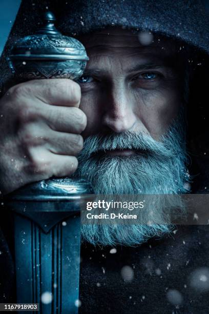 senior monk wearing traditional clothes with sword - viking warrior stock pictures, royalty-free photos & images