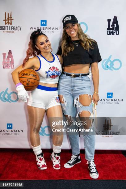 Mia Wright and Callie Rivers pose together at the Wright Legacy Foundation skate night at World on Wheels on August 03, 2019 in Los Angeles,...