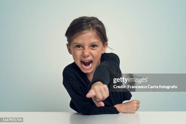 angry little girl - girl pointing stock-fotos und bilder