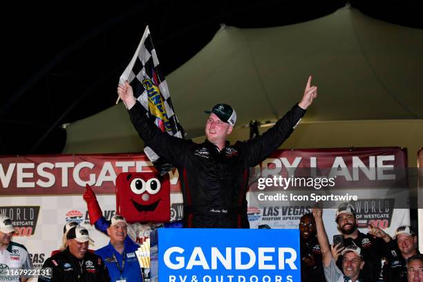 Austin Hill Hattori Racing Enterprises Toyota Tundra celebrates in Victory Lane after winning the World of Westgate 200 NASCAR Gander Outdoors Truck...