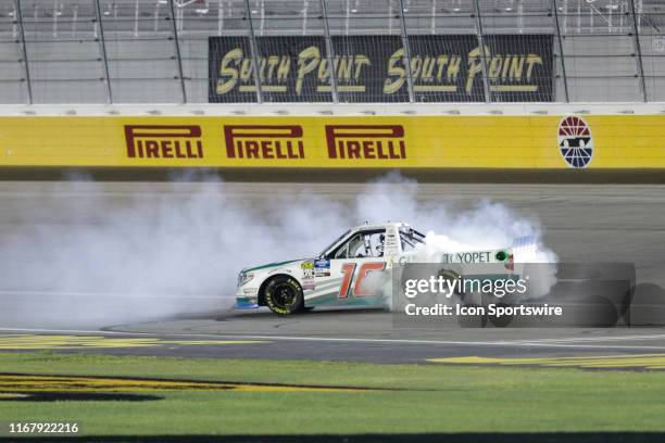 Austin Hill Hattori Racing Enterprises Toyota Tundra celebrates with a burnout after winning the World of Westgate 200 NASCAR Gander Outdoors Truck...