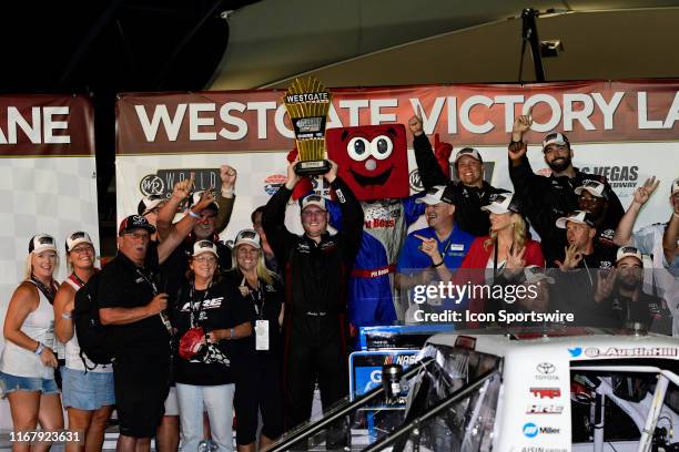 Austin Hill Hattori Racing Enterprises Toyota Tundra celebrates in Victory Lane after winning the World of Westgate 200 NASCAR Gander Outdoors Truck...