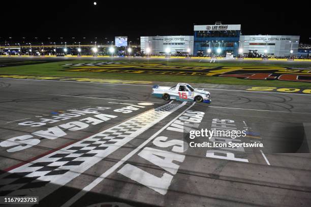 Austin Hill Hattori Racing Enterprises Toyota Tundra crosses the finish line to win the race during the NASCAR Gander Outdoors Truck Series World of...