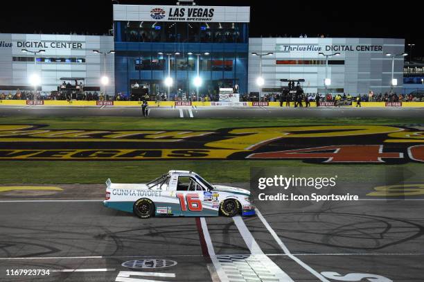 Austin Hill Hattori Racing Enterprises Toyota Tundra celebrates the race win at the finish line during the NASCAR Gander Outdoors Truck Series World...