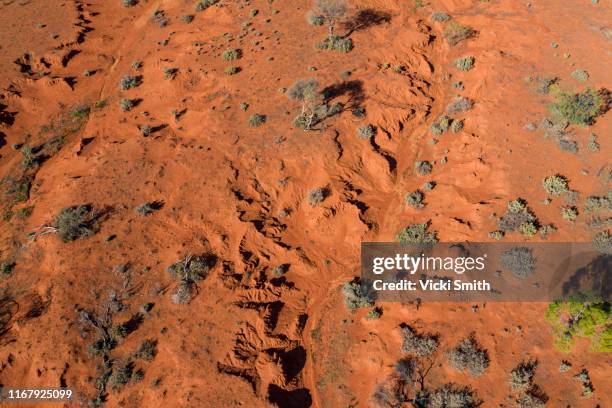 drone point of view over the red earth of the australian outback - country new south wales stock pictures, royalty-free photos & images