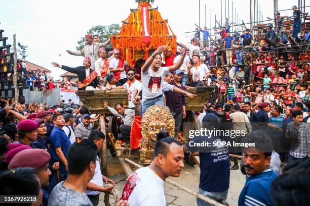 Devotees pull the chariot of Living Goddess Kumari during the main day of the Indra Jatra festival. People across the country attended the eight-day...