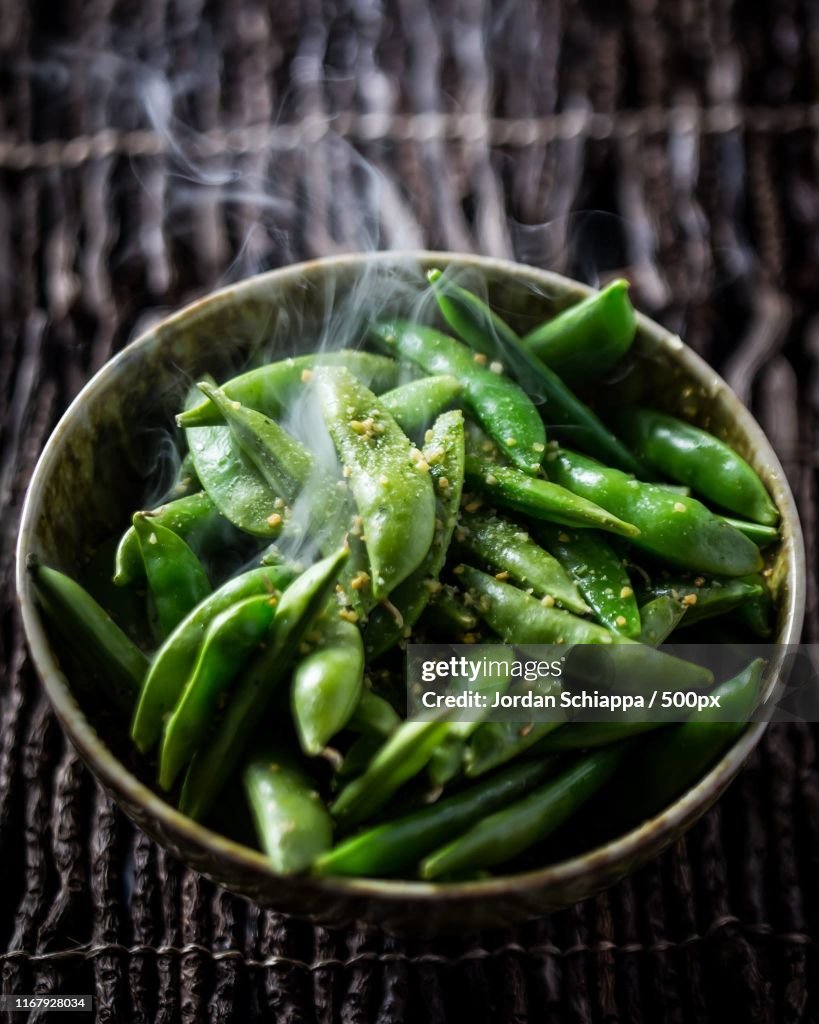 Steaming edamame beans in bowl