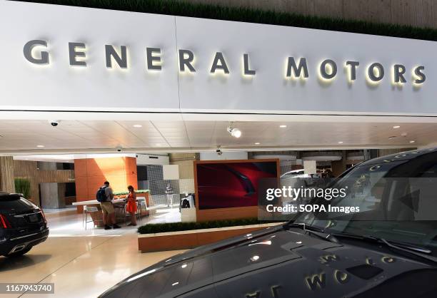 Vehicles are seen displayed at the General Motors world headquarters building in Detroit's Renaissance Center.