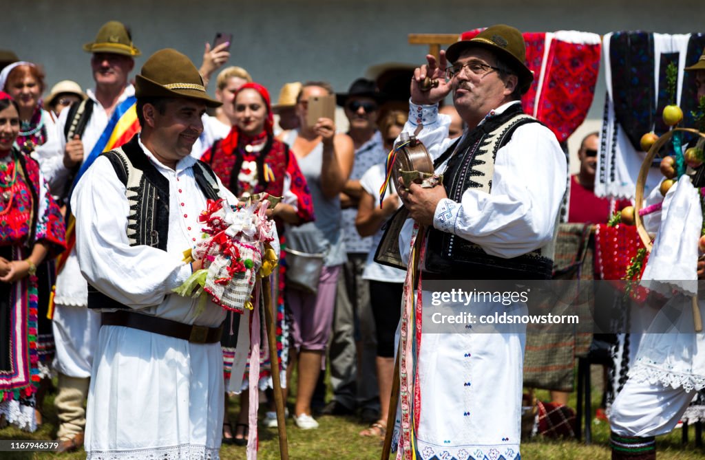 People Wearing Traditional Romanian Clothing Outdoors In Rural ...
